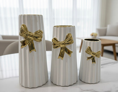 Elegant White and Black Ceramic Fluted Vases with Gold Bow Accent (Only In Karachi)