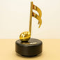 Musical Notes Wind-Up Music Box – Golden Rotating Melody Showpiece for Music Lovers