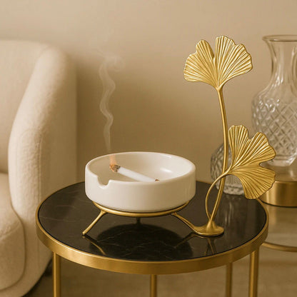 LUXURY VILLA SIDE TABLE DECOR - CERAMIC ASHTRAY WITH LIT CIGARETTE & GOLD GINKGO LEAF ORNAMENT
